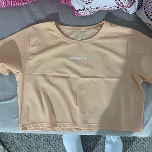 Alphalete shirt in light orange color